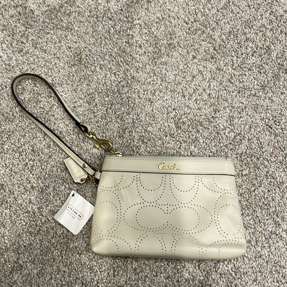 Cream/ivory NWT Coach Wristlet.